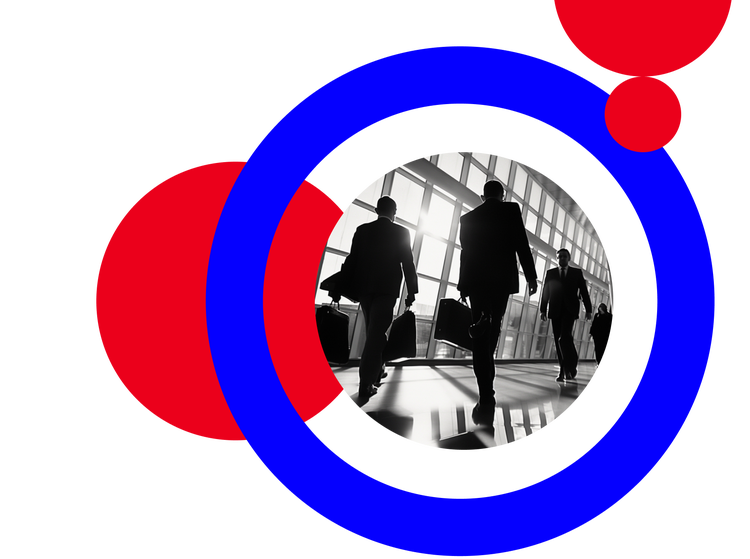 Men with suit case walking down a hall