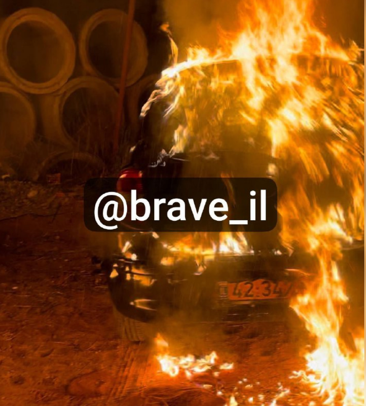 Car on fire with the overlay text of @brave_il